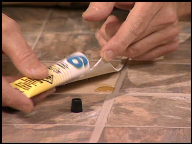 Apply All Purpose Adhesive To Re-Stick Curling Self-Adhesive Vinyl Tiles.jpg